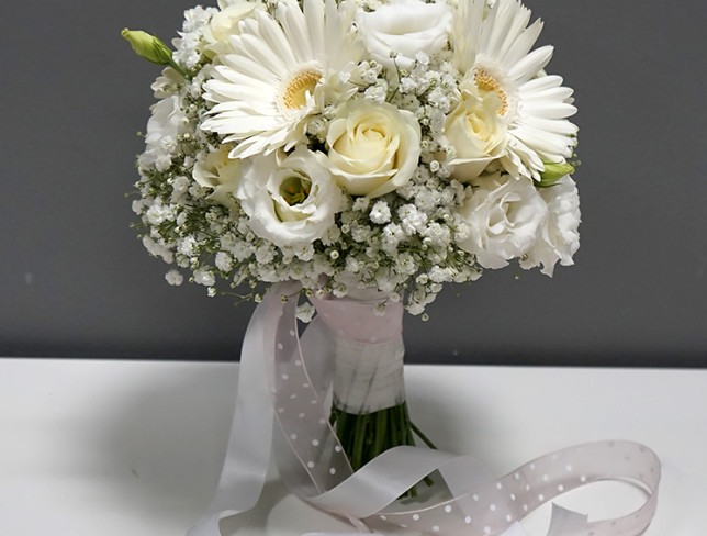 Bride's bouquet of white roses, gypsophila and gerberas photo